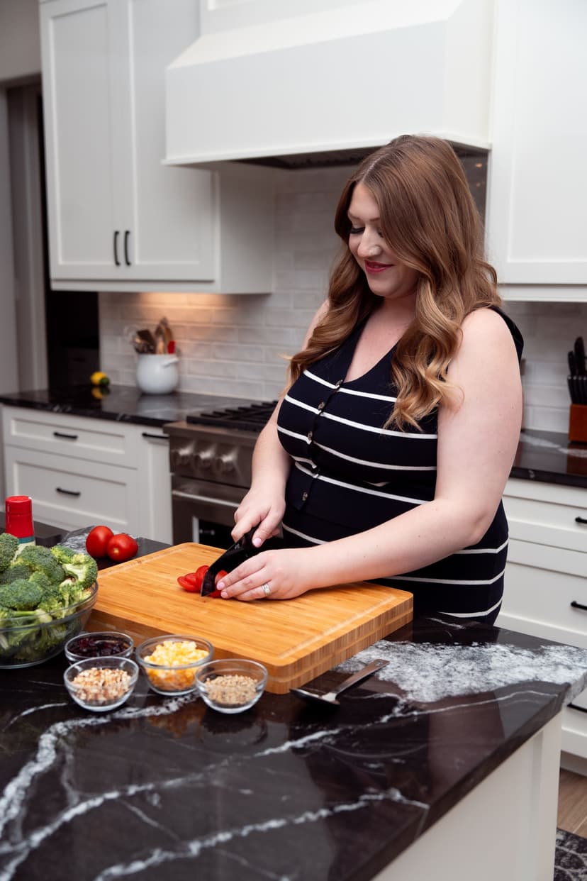 Woman cooking in a professional kitchen for food and beverage brand photography